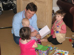 Josie very kindly helping Ben and Anna open presents