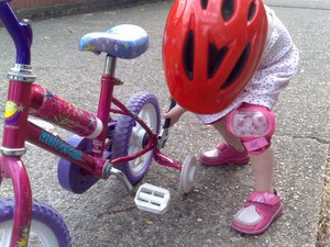 Josie fixing her bike