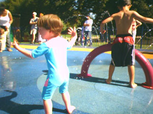 Josie in the water play park